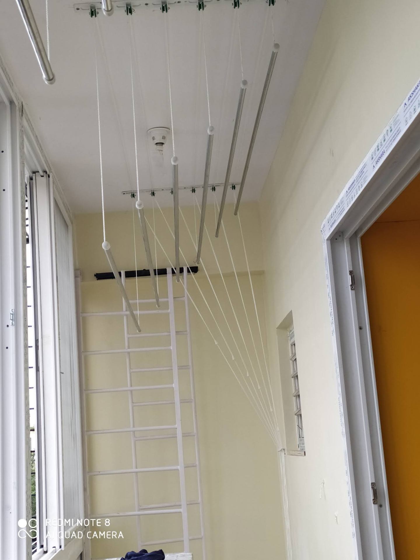 Stainless steel ceiling hanger in apartment utility area